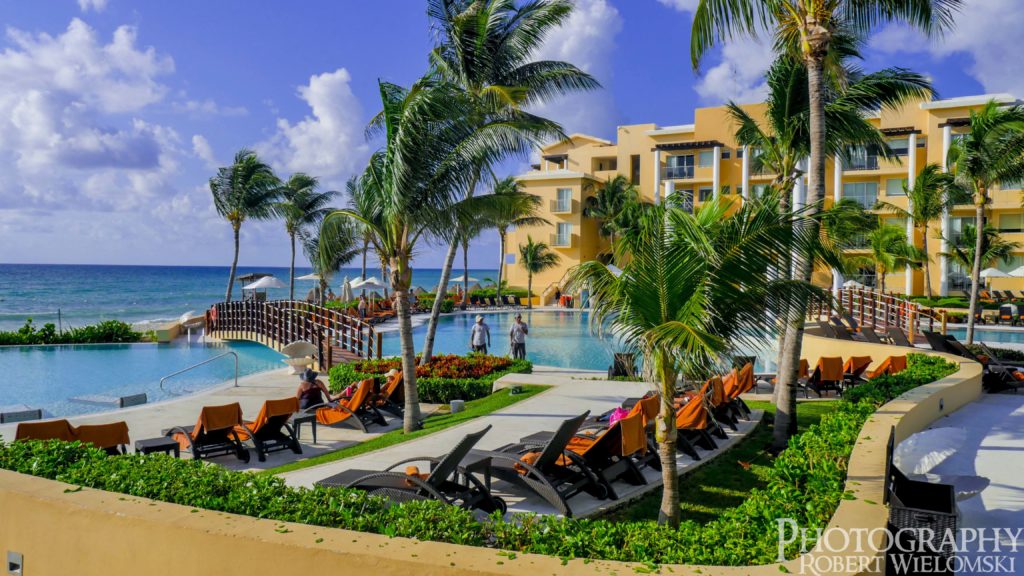 Pool side and ocean view at Now Jade resort in Riviera Maya, Mexico. find cheap vacation packages.