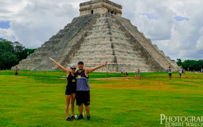 Robert Wielomski and Courtney Moonen posing in front of Kukulcan EL Castillo. Booking awesome Trips. find cheap vacation packages