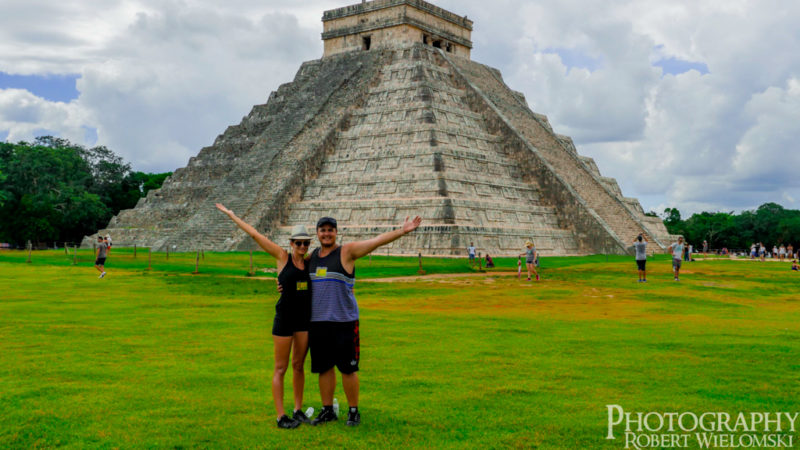 Robert Wielomski and Courtney Moonen posing in front of Kukulcan EL Castillo. Booking awesome Trips. find cheap vacation packages